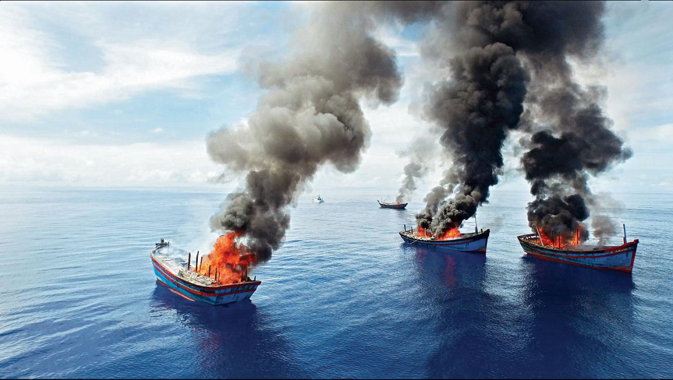 Fishing vessels set ablaze.