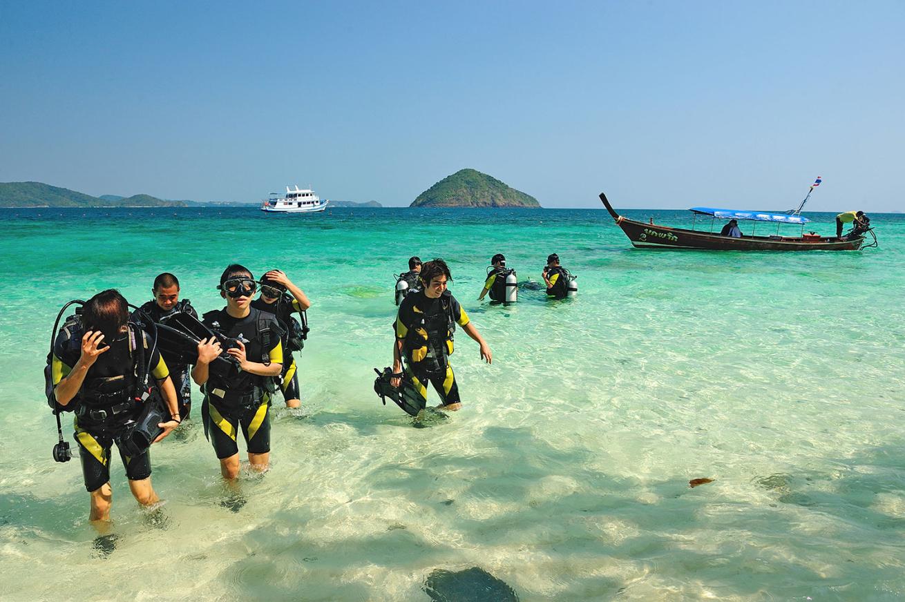 Scuba Divers coming out from the water