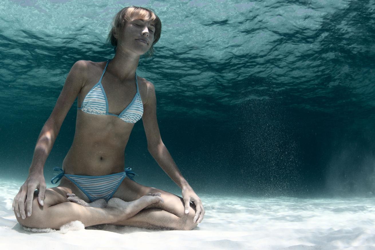 Woman Underwater holding breath