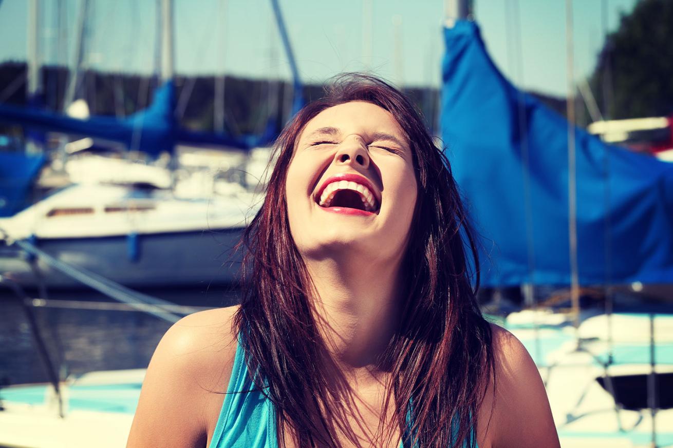 Woman laughing on boat