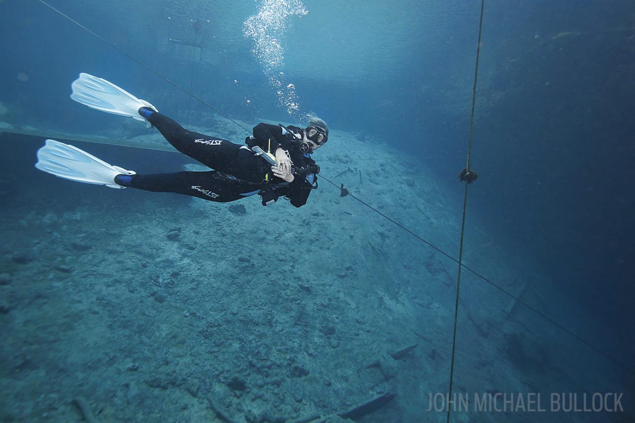 Scuba diver testing gear underwater photo Blue Grotto, Florida