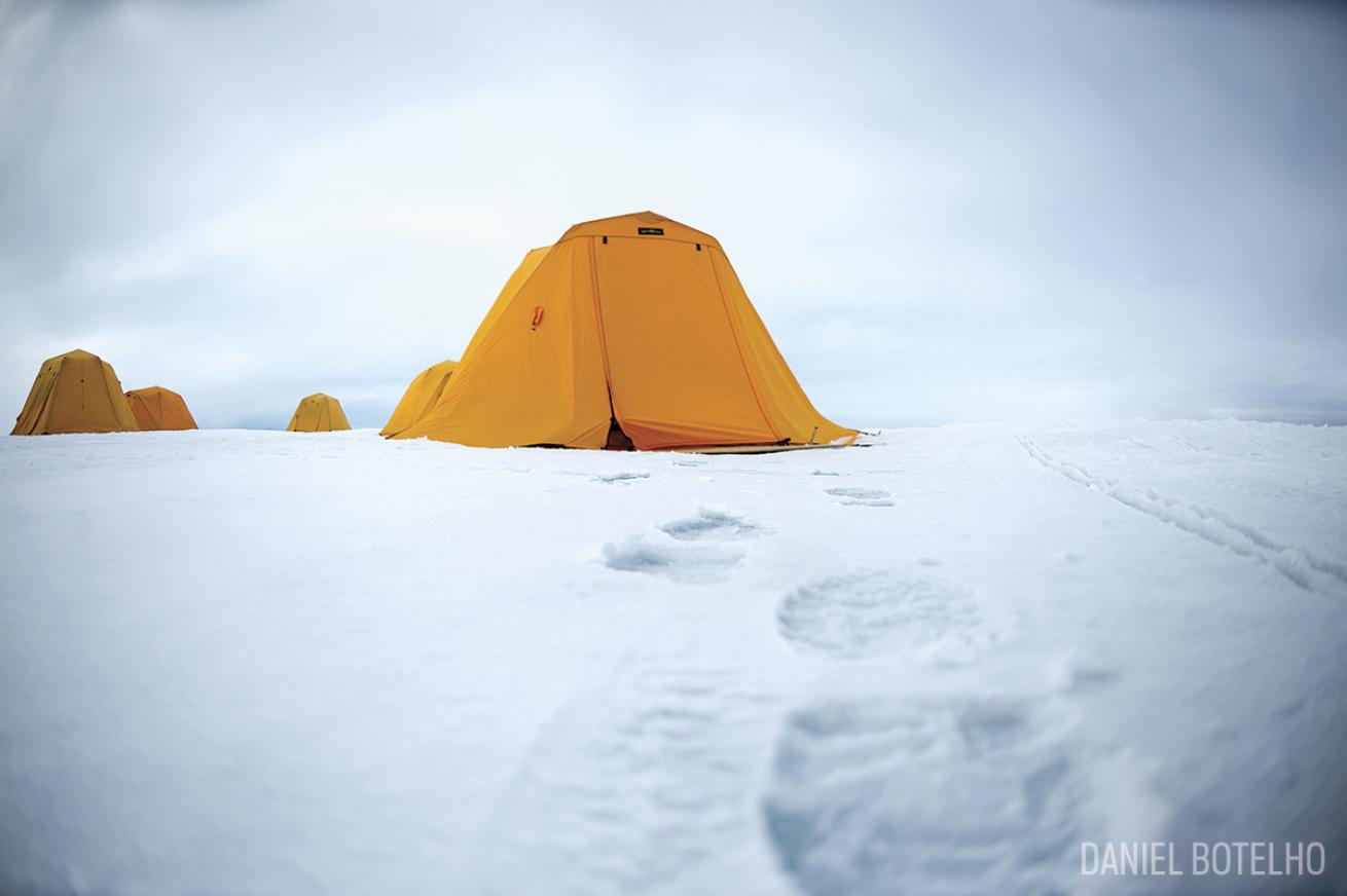 Orange Tent on Ice at a Campsite in the High Arctic