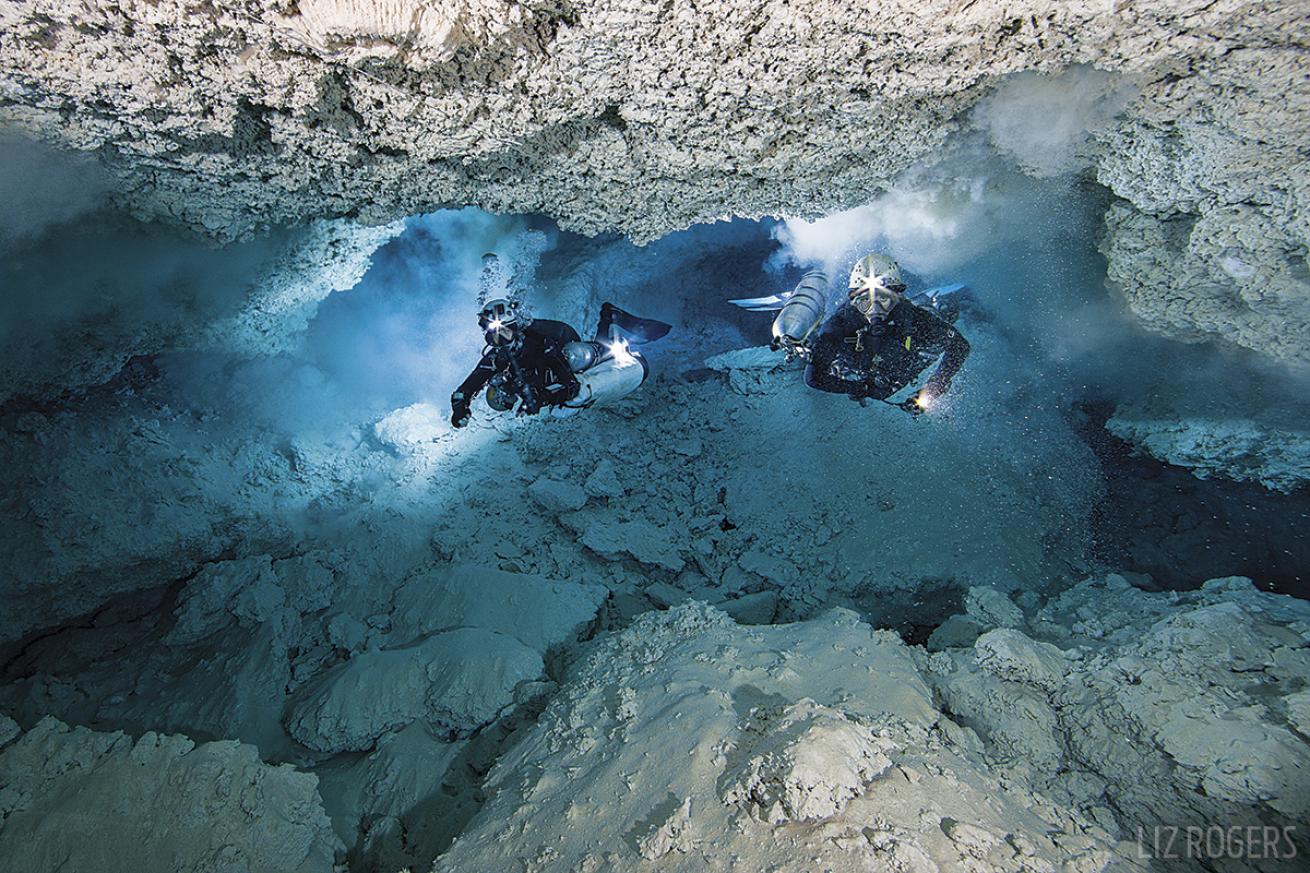 Scuba diving in underwater caves filled with fossils in West Timor, Indonesia