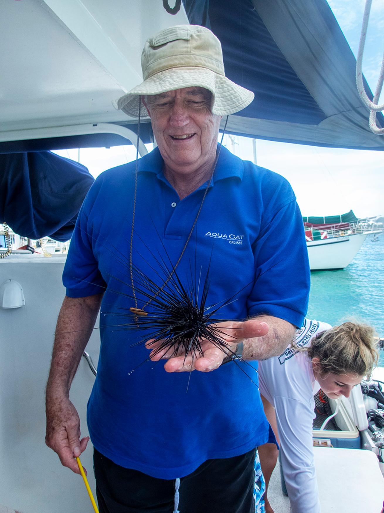 All Star founder Bruce Purdy holds Diadema antillarum.