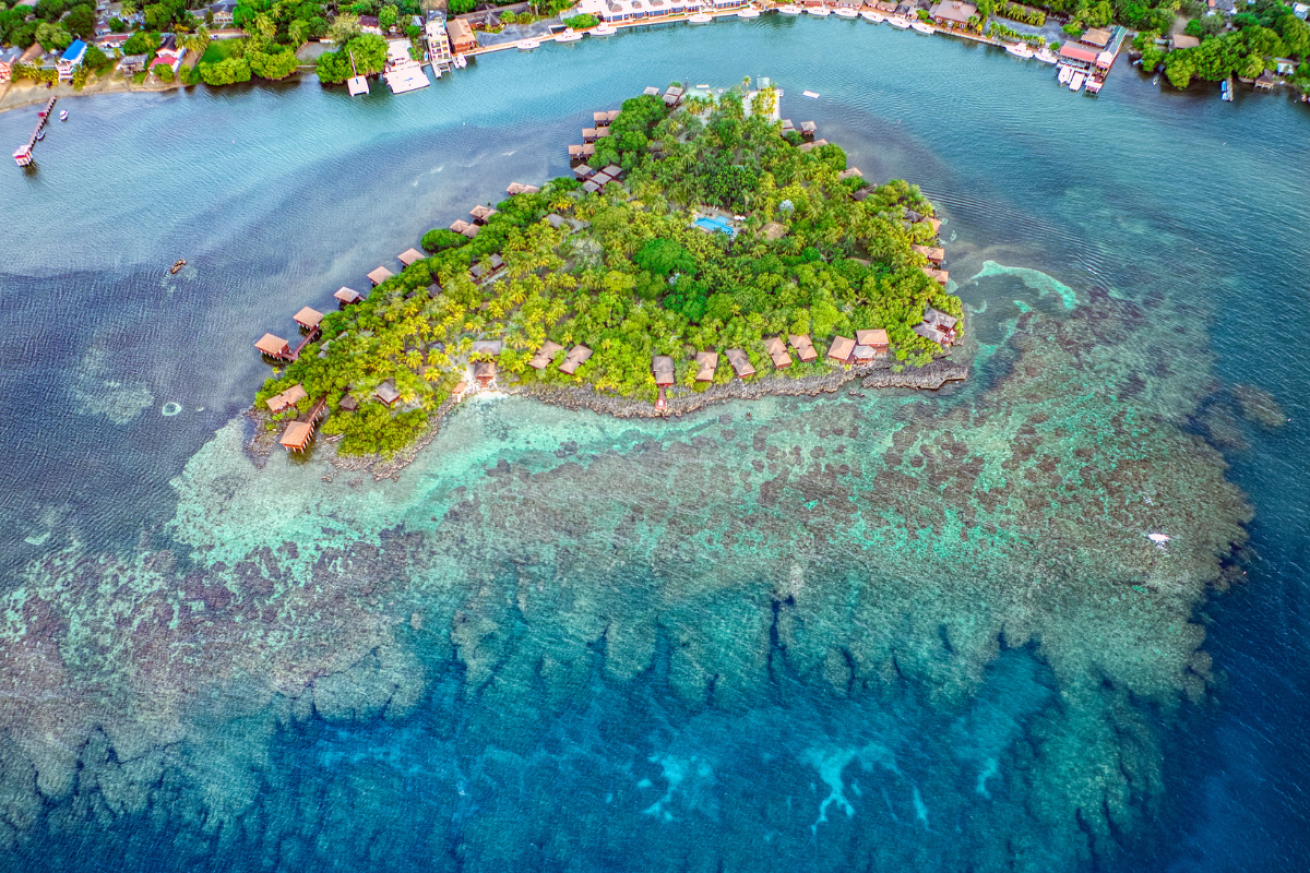 Ariel shot of the AKR island with bungalows on it.