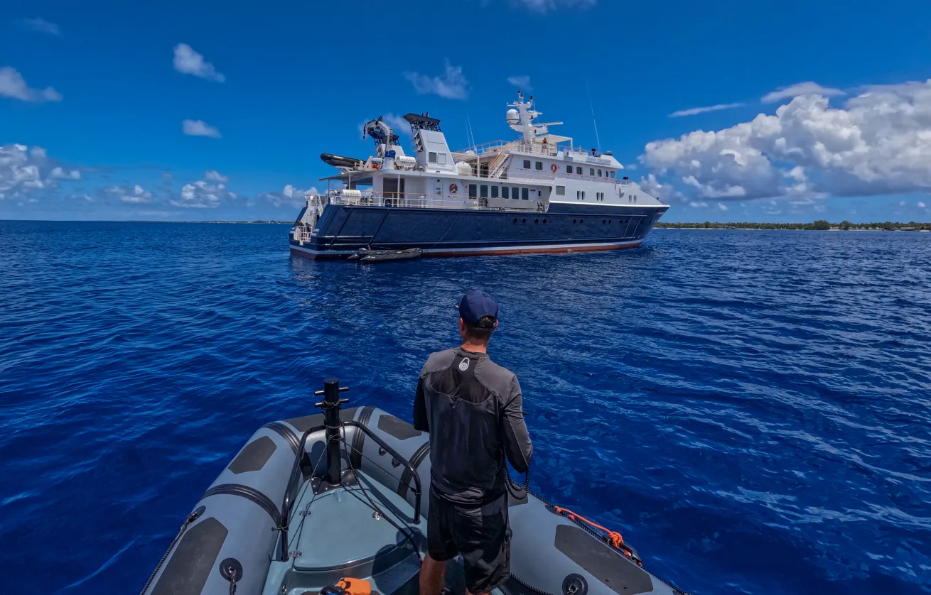 Divers return to the Hanse Explorer, their floating base camp, in between dives.