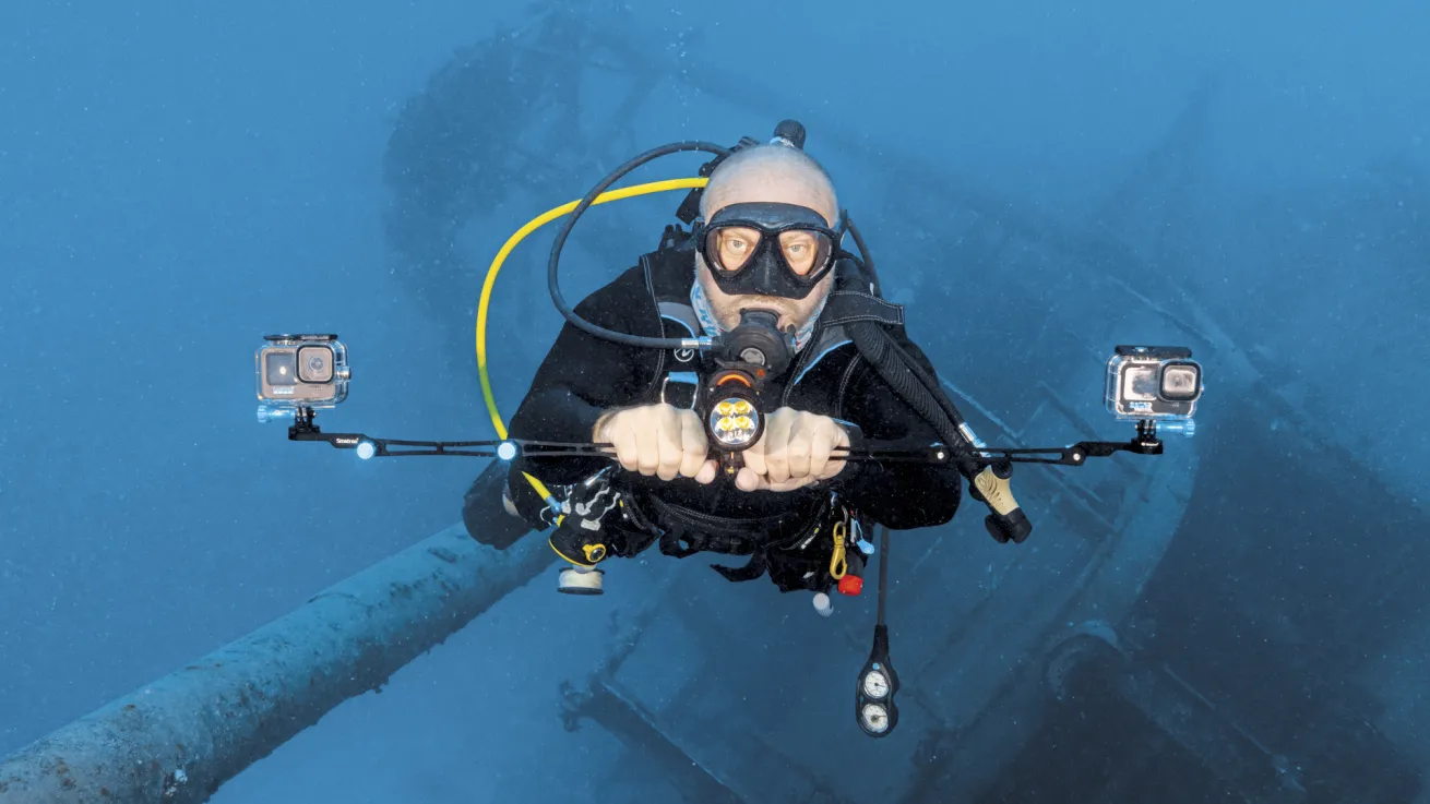 a scuba diver uses two gopros to map the kittiwake wreck