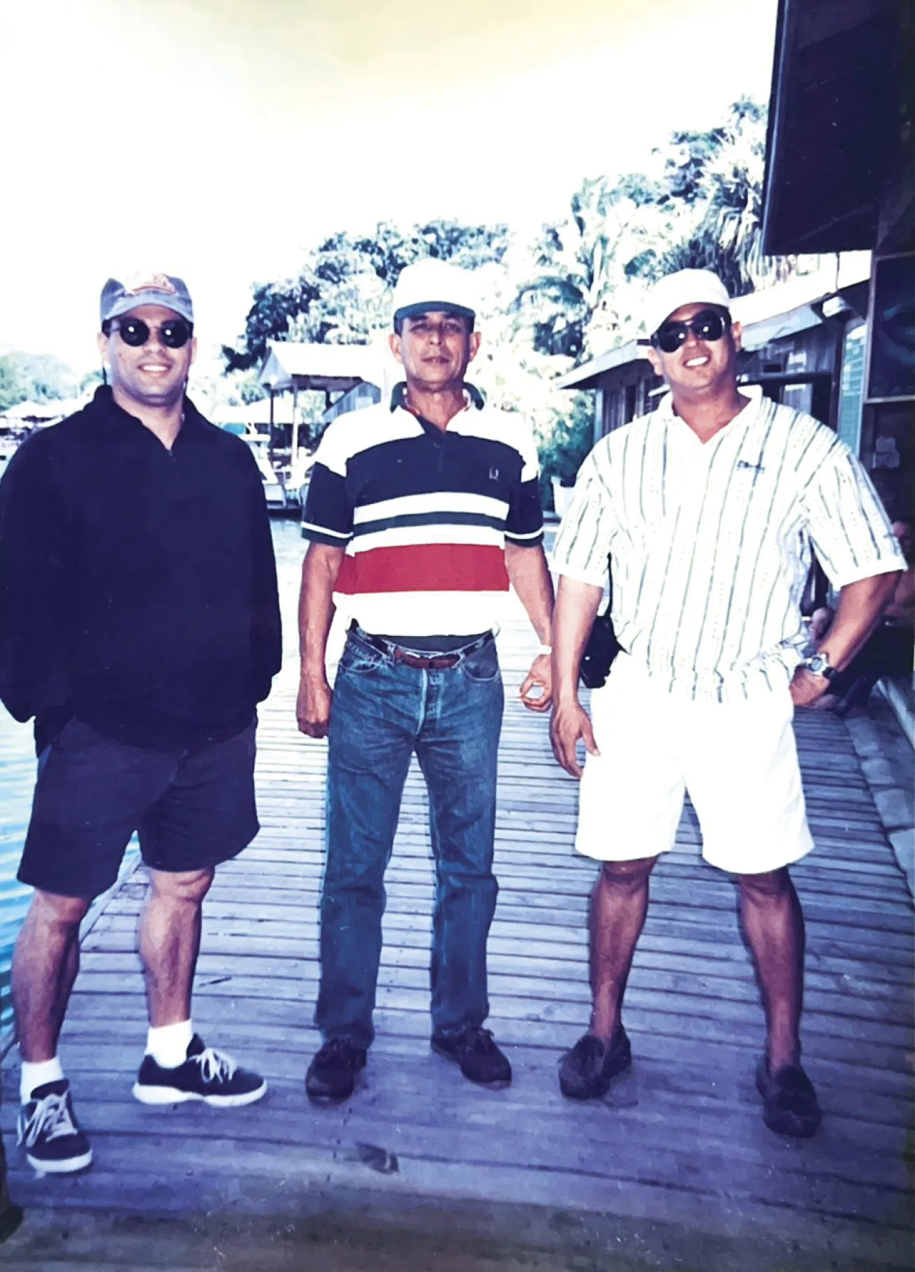 An older photograph of Galindo and his two sons on the dock at Anthony’s Key Resort.
