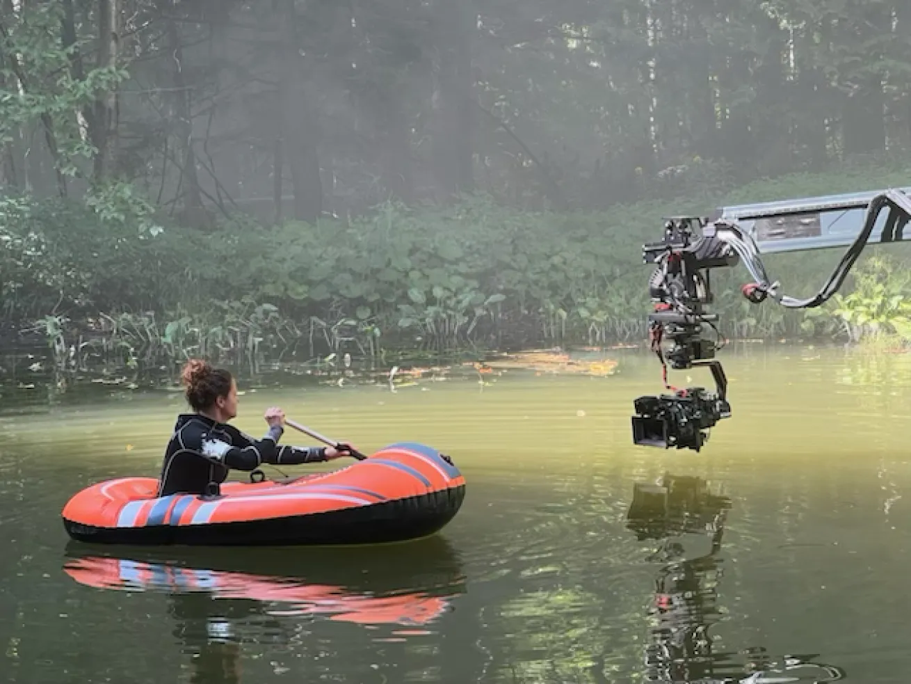 Water safety sometimes involves setting props or scenes in the water, seen here setting lily pads for an establishing shot on a Hallmark TV series, *The Way Home*. 