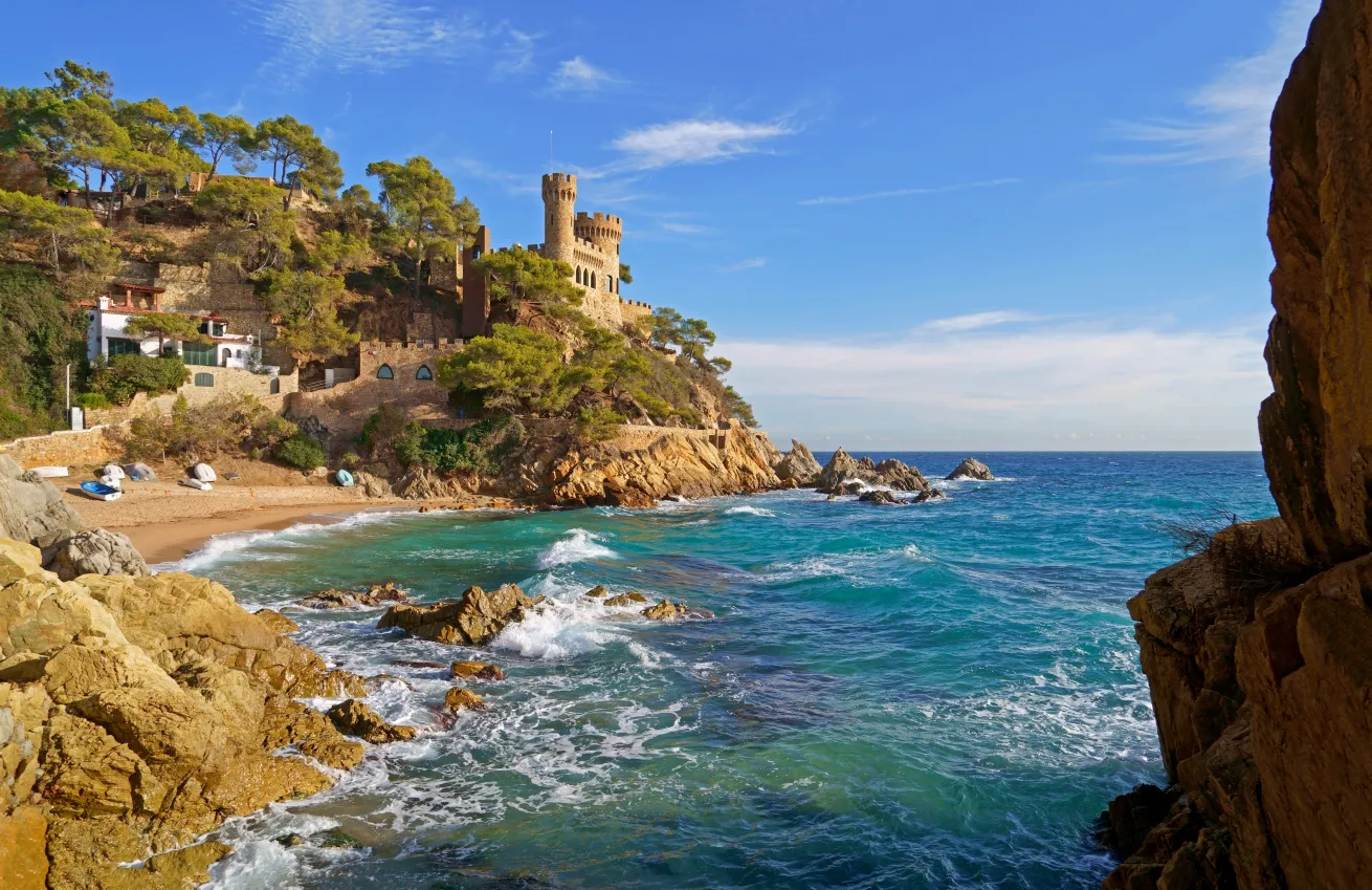 Coast of the Costa Brava. Catalonia. Spain Lloret de Mar. Mediterranean Sea. Beautiful rocks. A sea wave hits the shore