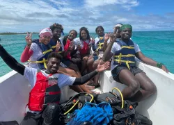 BIP Week participants after completing a dive  .png.webp