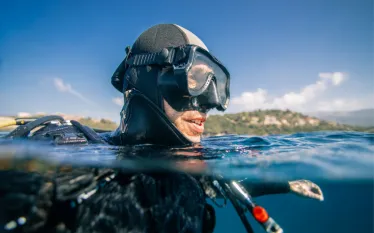 scuba-diver-at-sea-surface-picture-id.jpg.webp