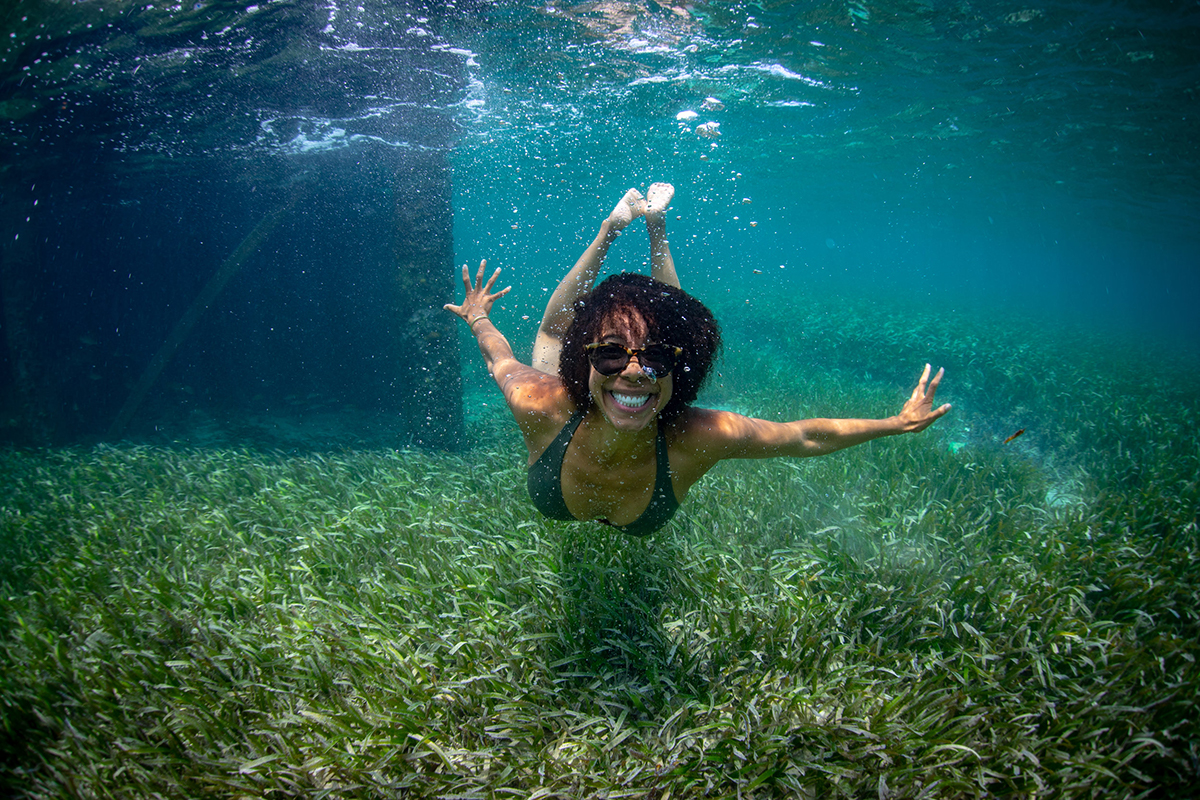 Dr. Ayana Elizabeth Johnson swims over seagrass