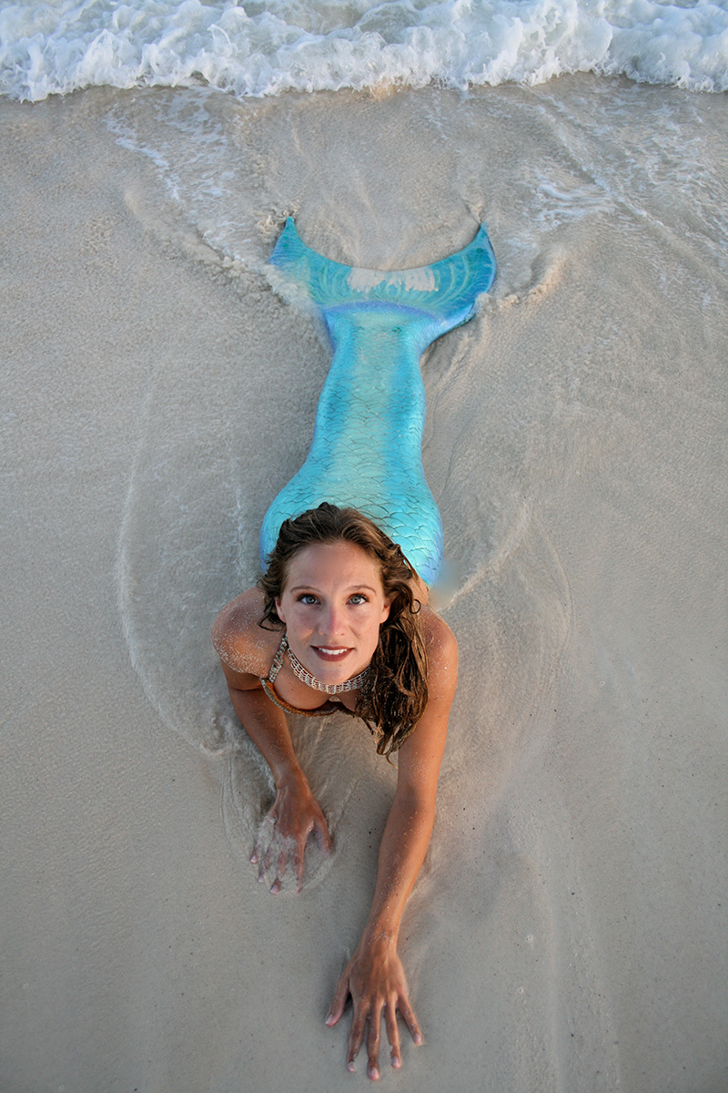 beach in her full mermaid outfit.