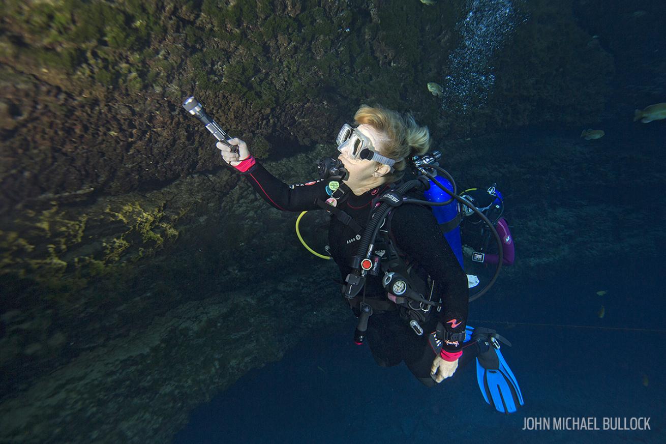 Underwater in Florida Cave: Scuba Divers Test Dive Lights