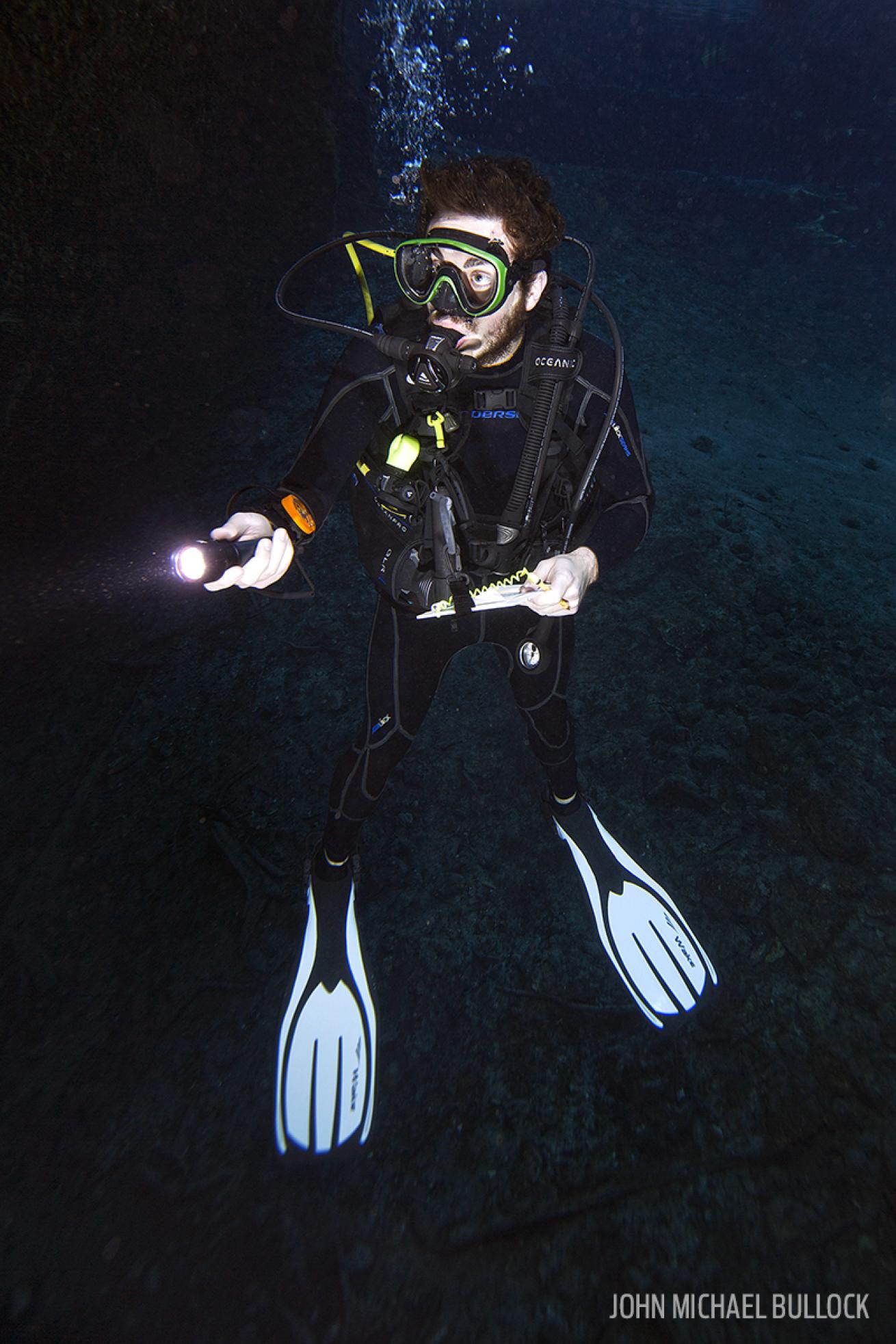 Scuba Diver Underwater with Dive Light in Florida