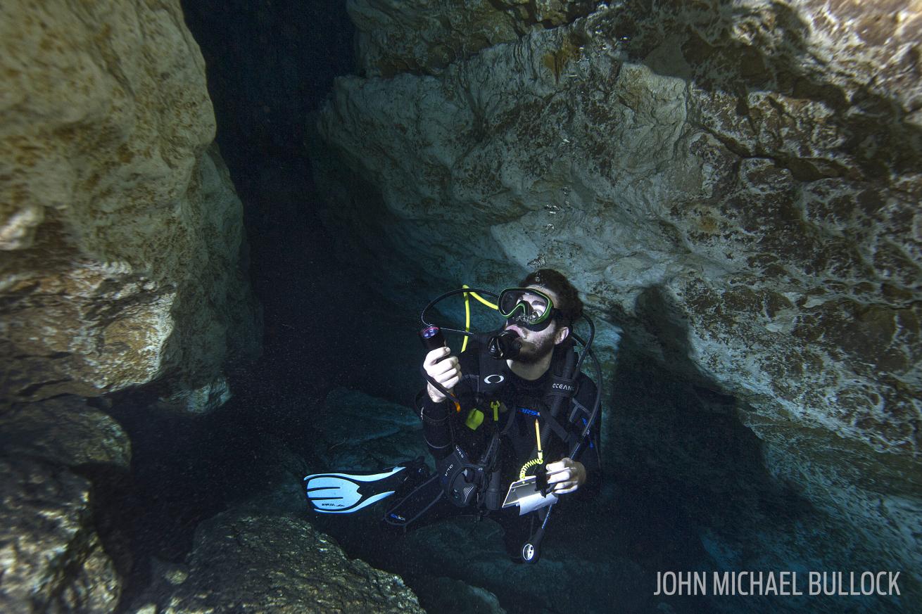 Underwater cave and scuba diver testing gear