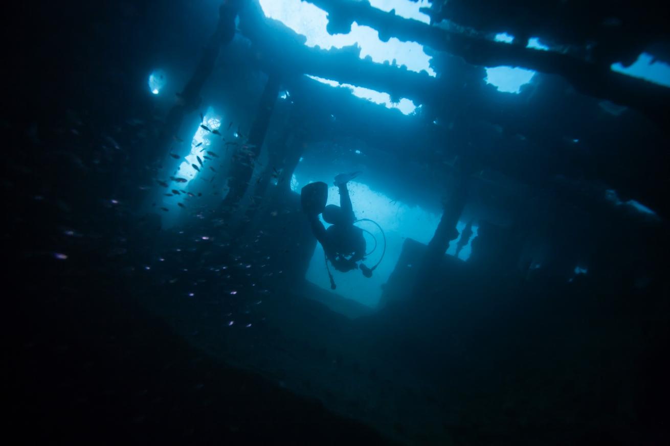 Scuba Diver Underwater Safely Exiting a Wreck