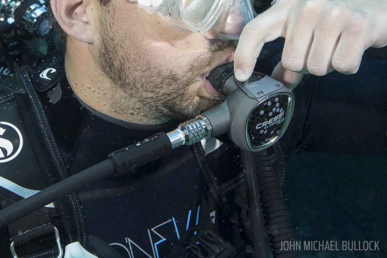 Close up of scuba diver's regulator underwater