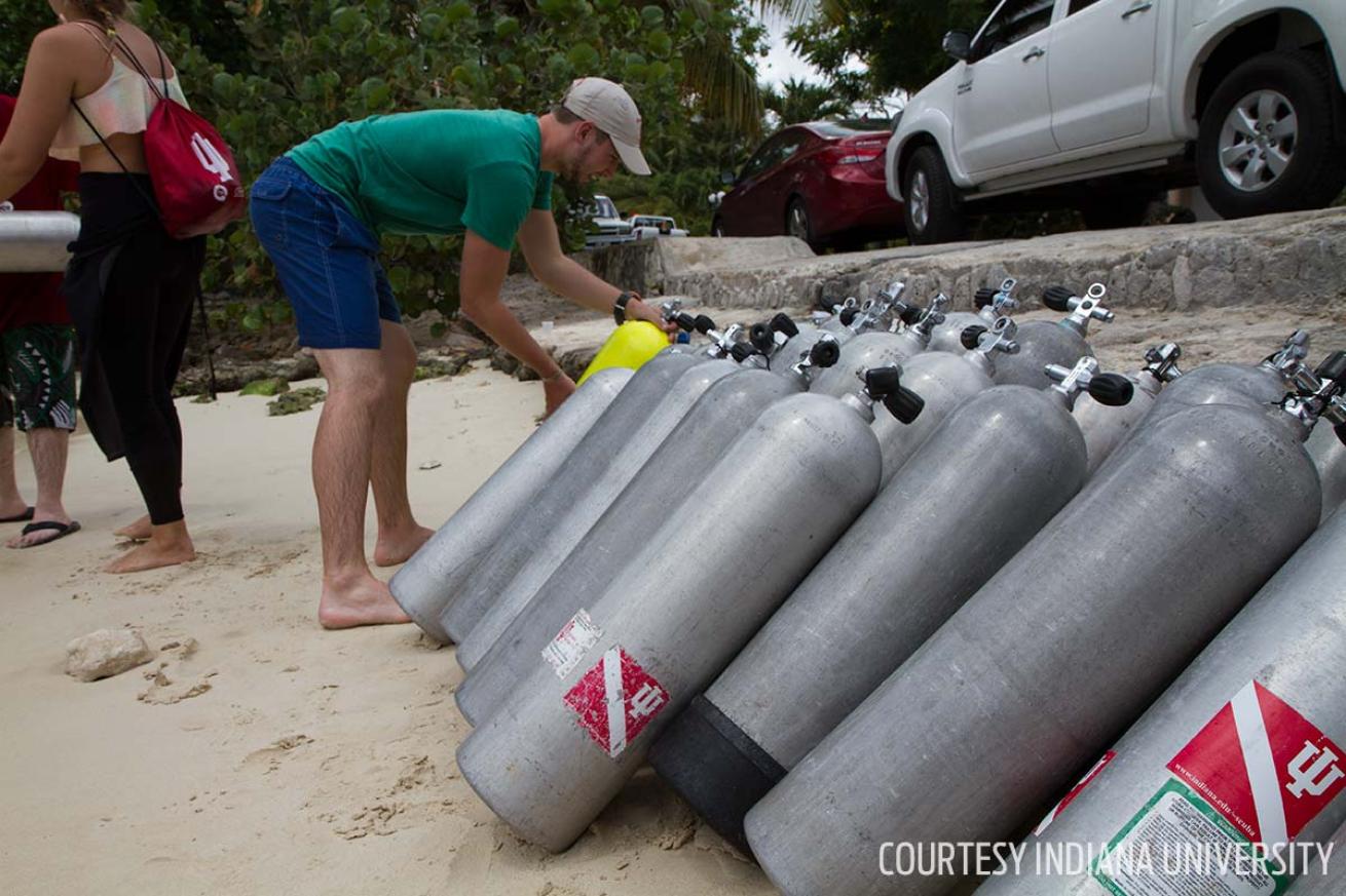 IU academic scuba divers prepare tanks for field research