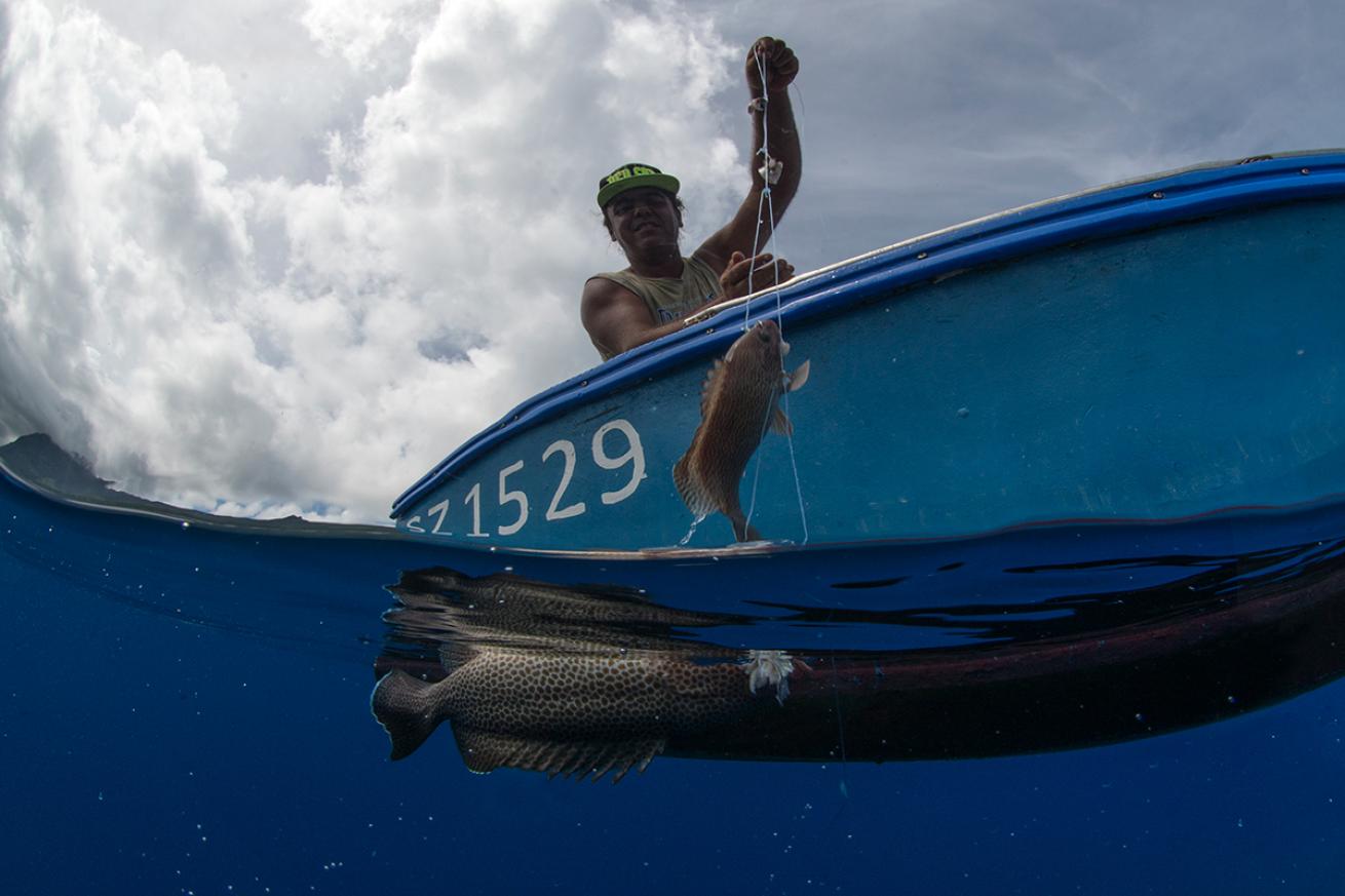 A Seychellois reels in his catch