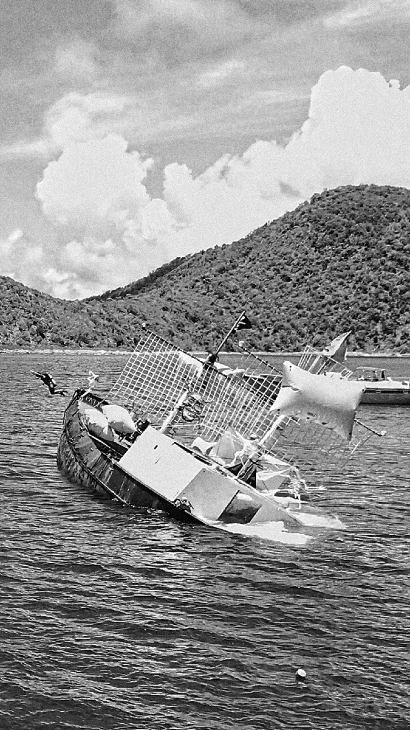 Chris Juredin leaps from the *Willy T* as the purpose-sunk "wreck" goes down.