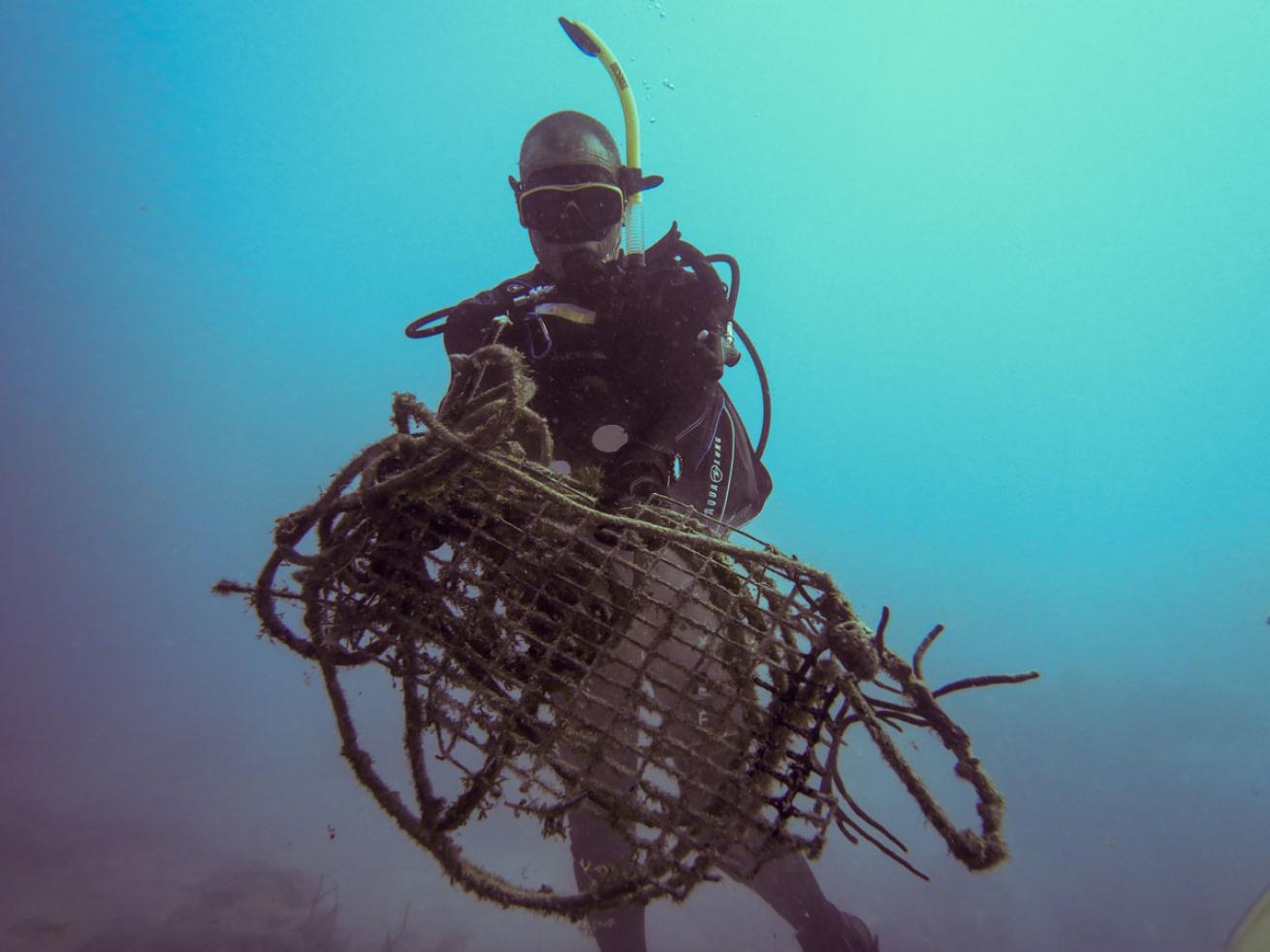 Scuba Diver Doug Hoffman Collects Trash Underwater