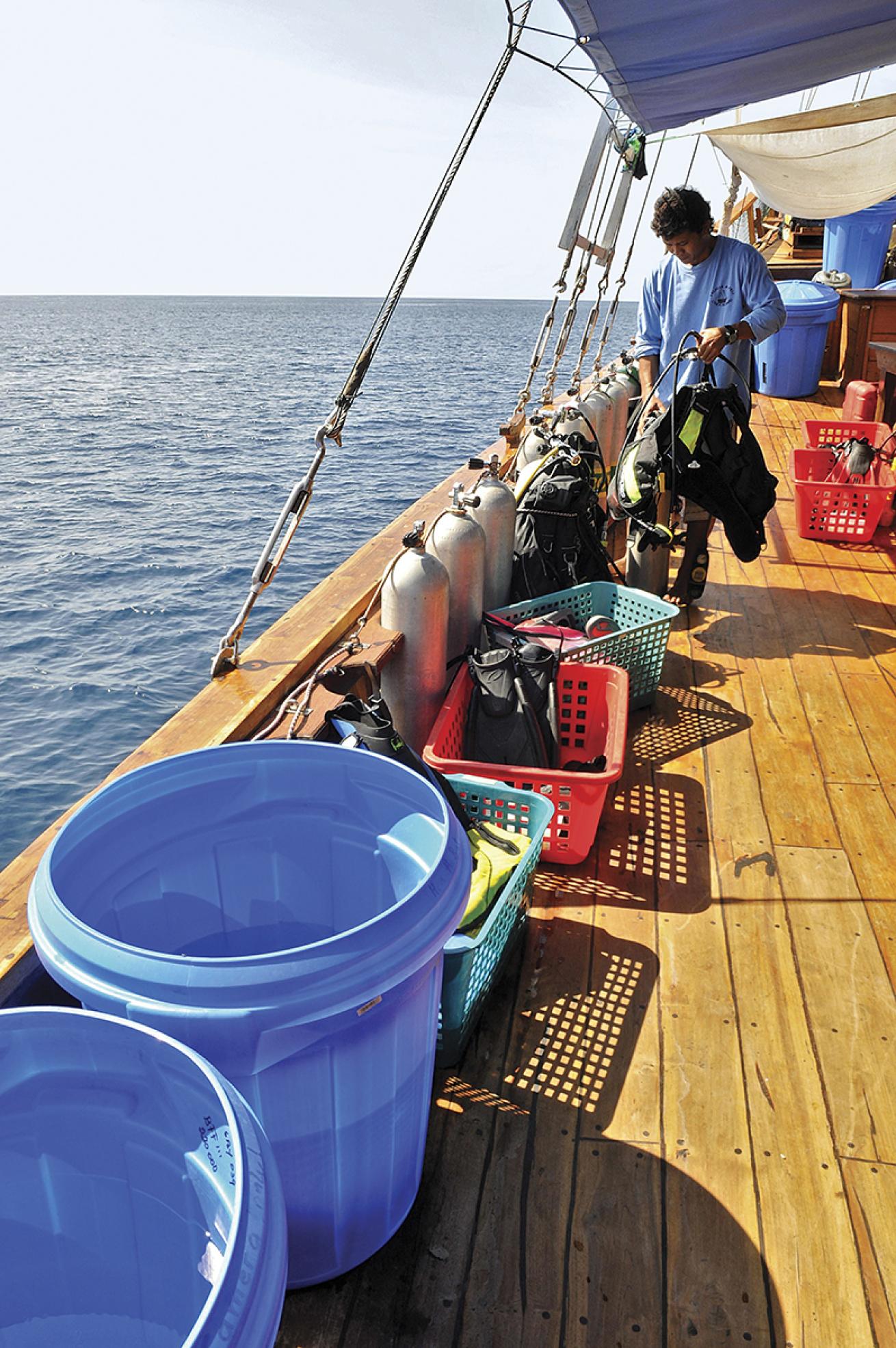 Scuba wash buckets and gear on a liveaboard