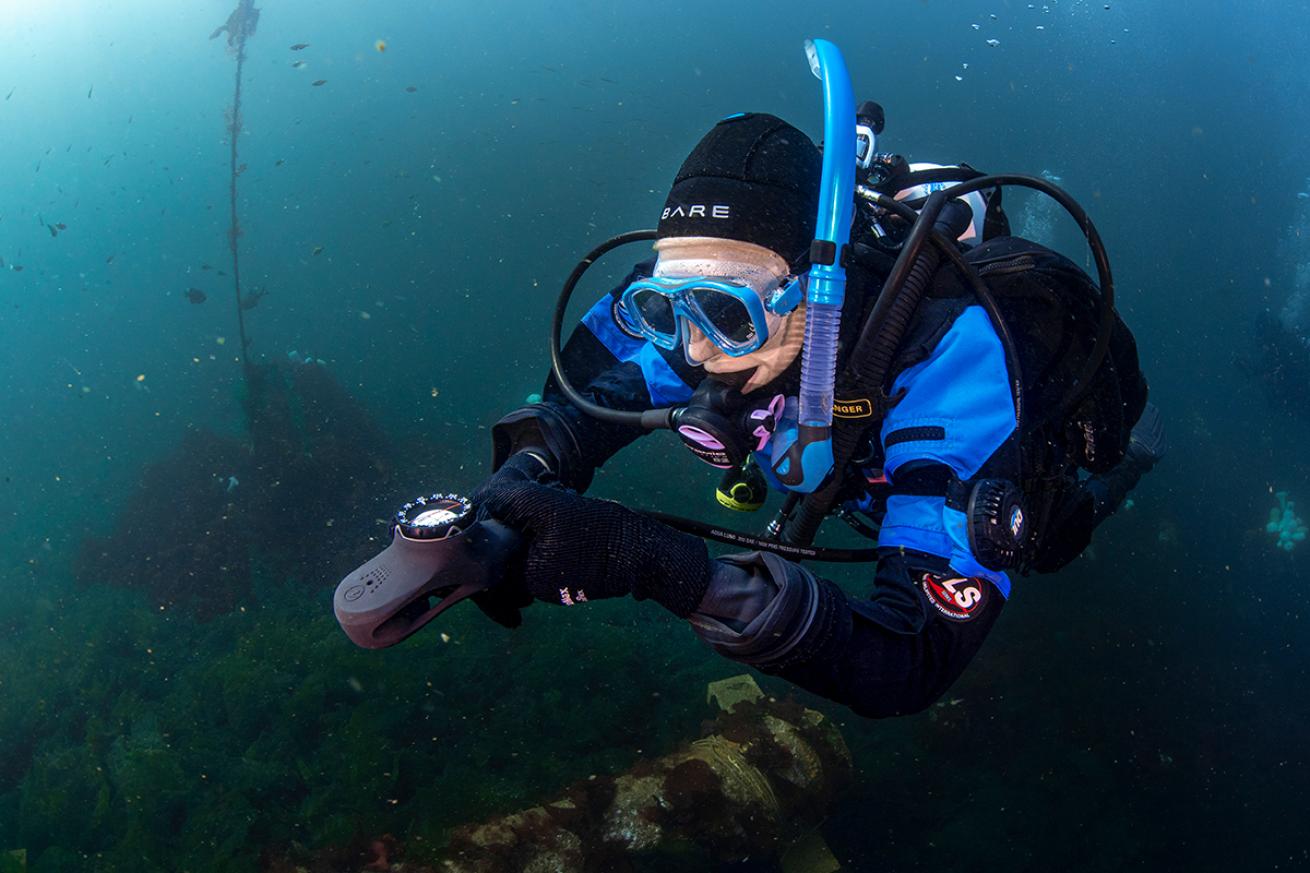 Diver navigating underwater