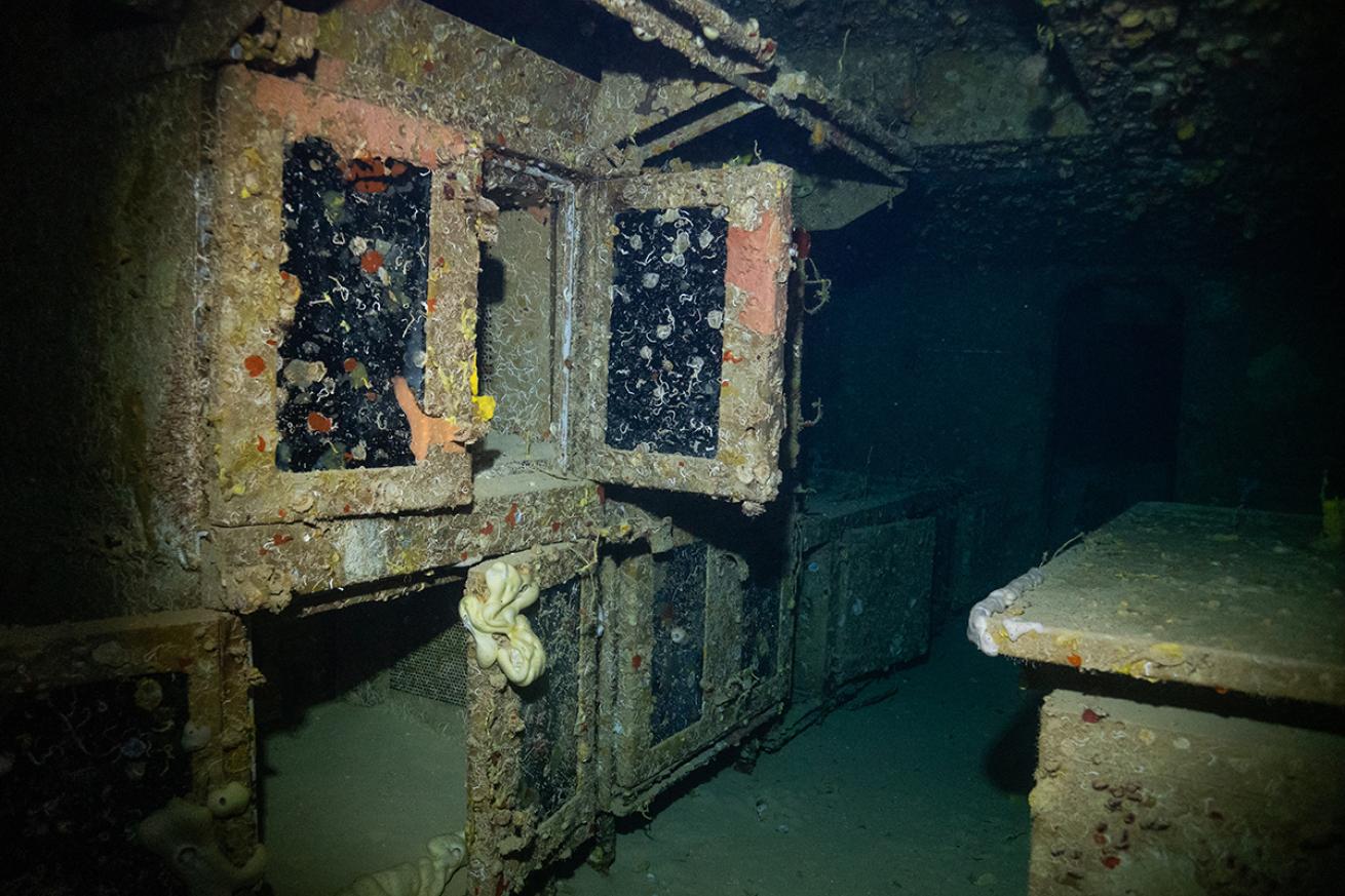 The galley of the USS Spiegel Grove partially light by a diver&#039;s light.