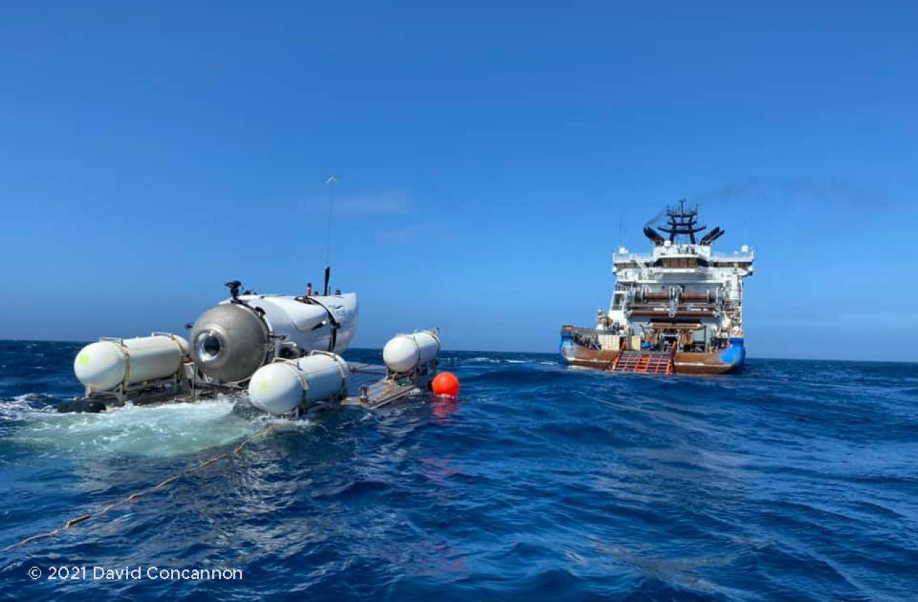 Submersible with expedition vessel in the background