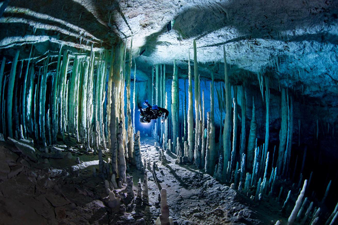 Cave diver in Crystal Palace, Abaco, Bahamas