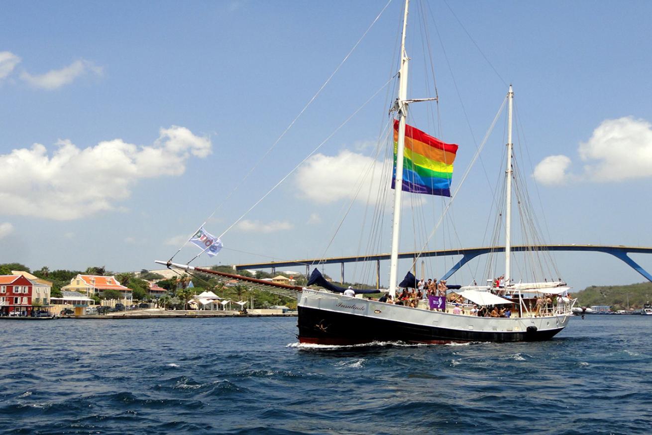 Gay pride flag flying on boat in Curaçao