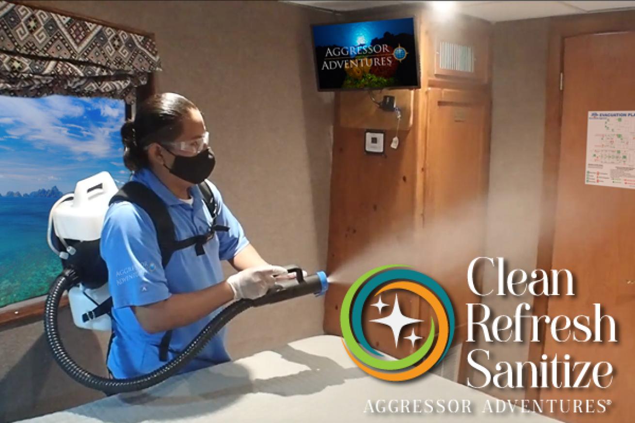 A person wearing a mask cleaning a room