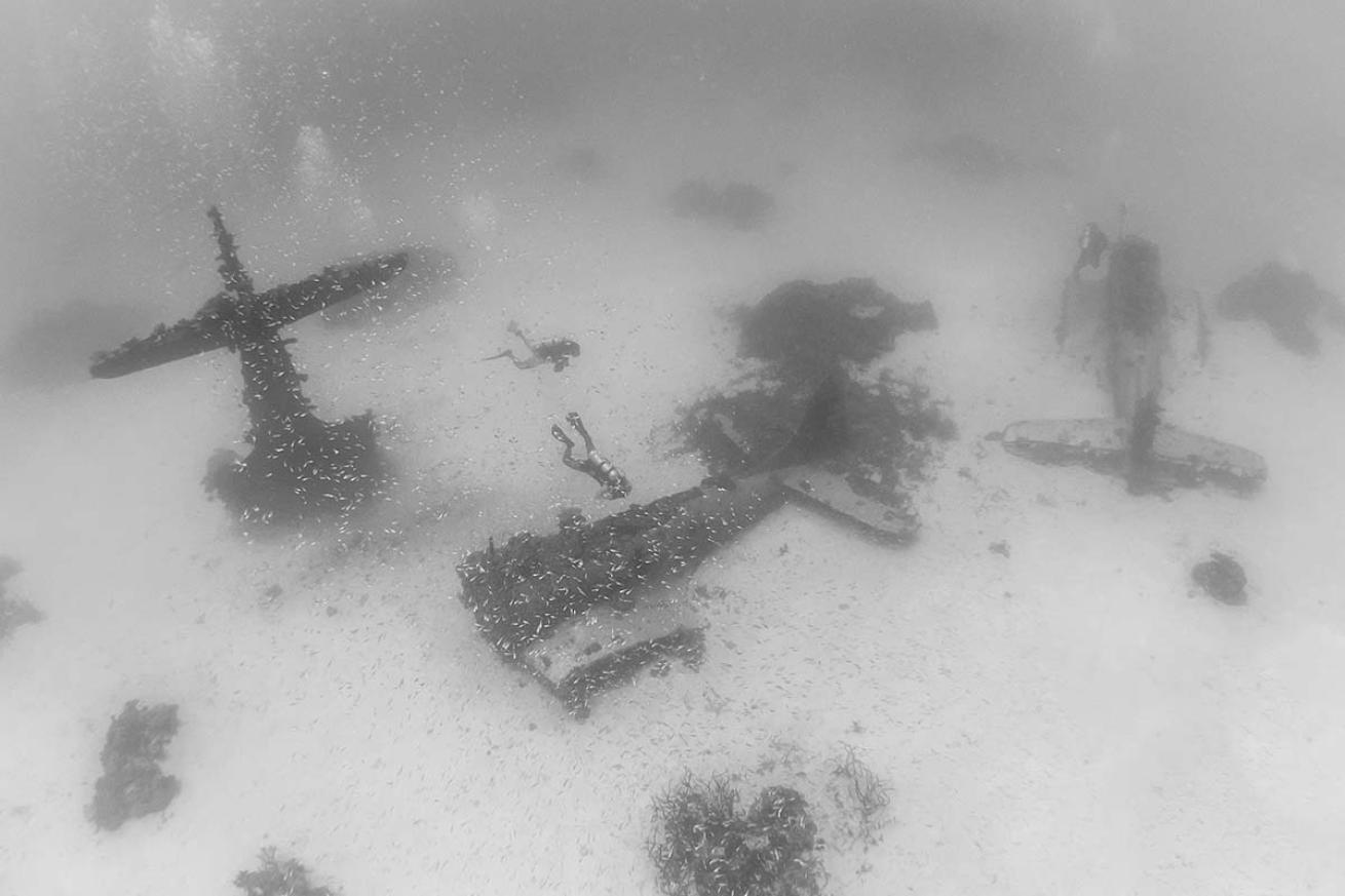 Divers with sunken planes