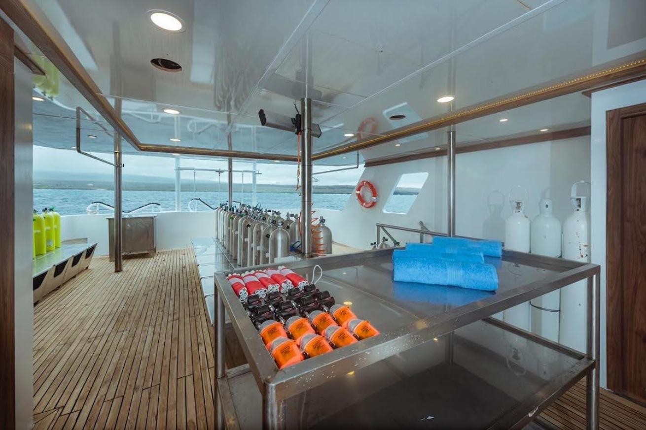 A boat dive deck with scuba gear