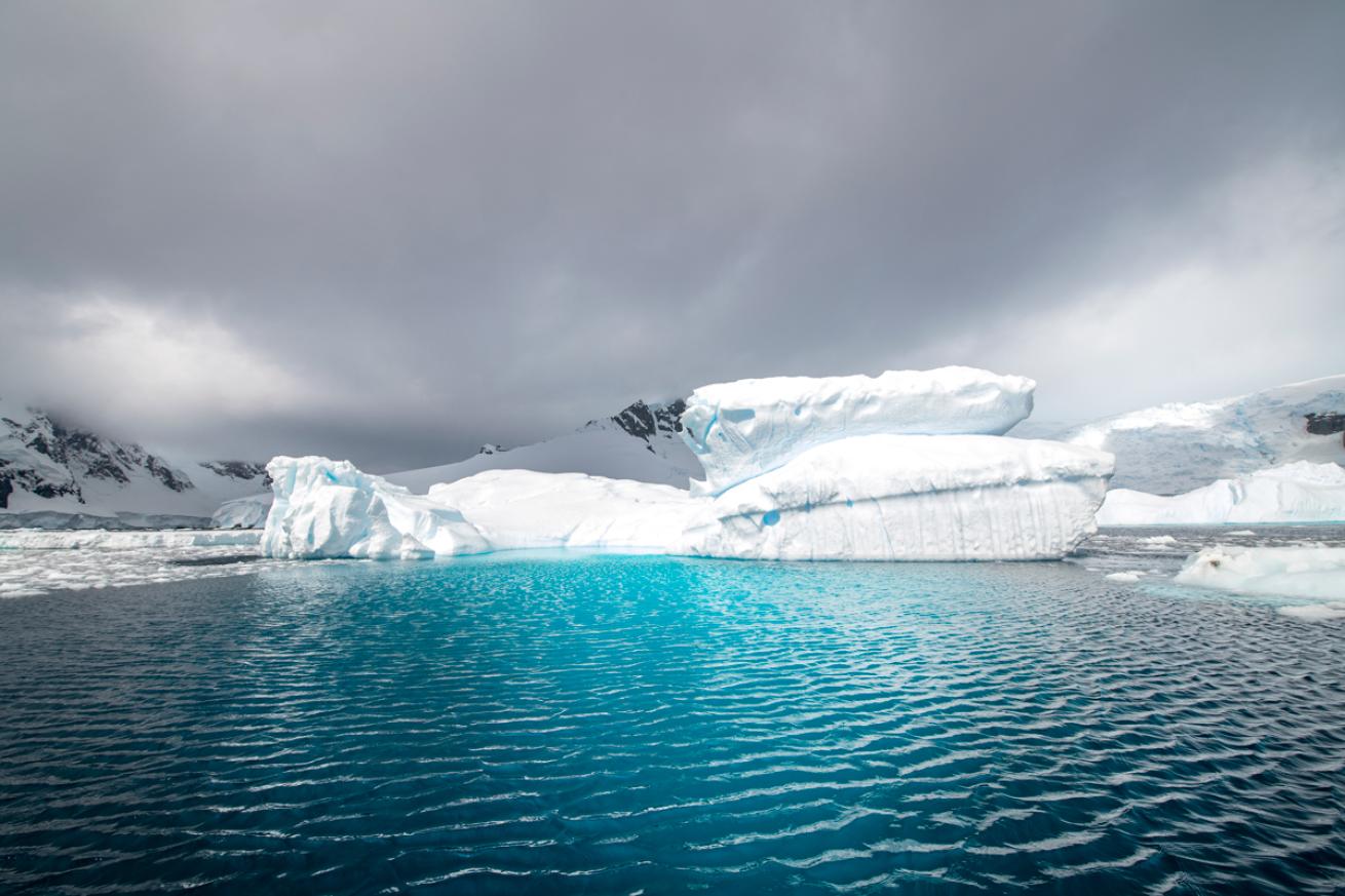 Iceberg in blue water