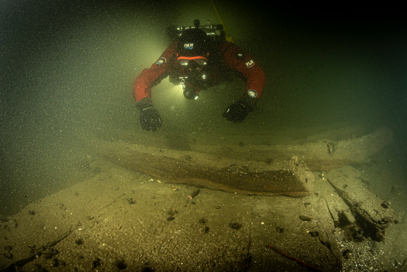 Research diver hover over wreck