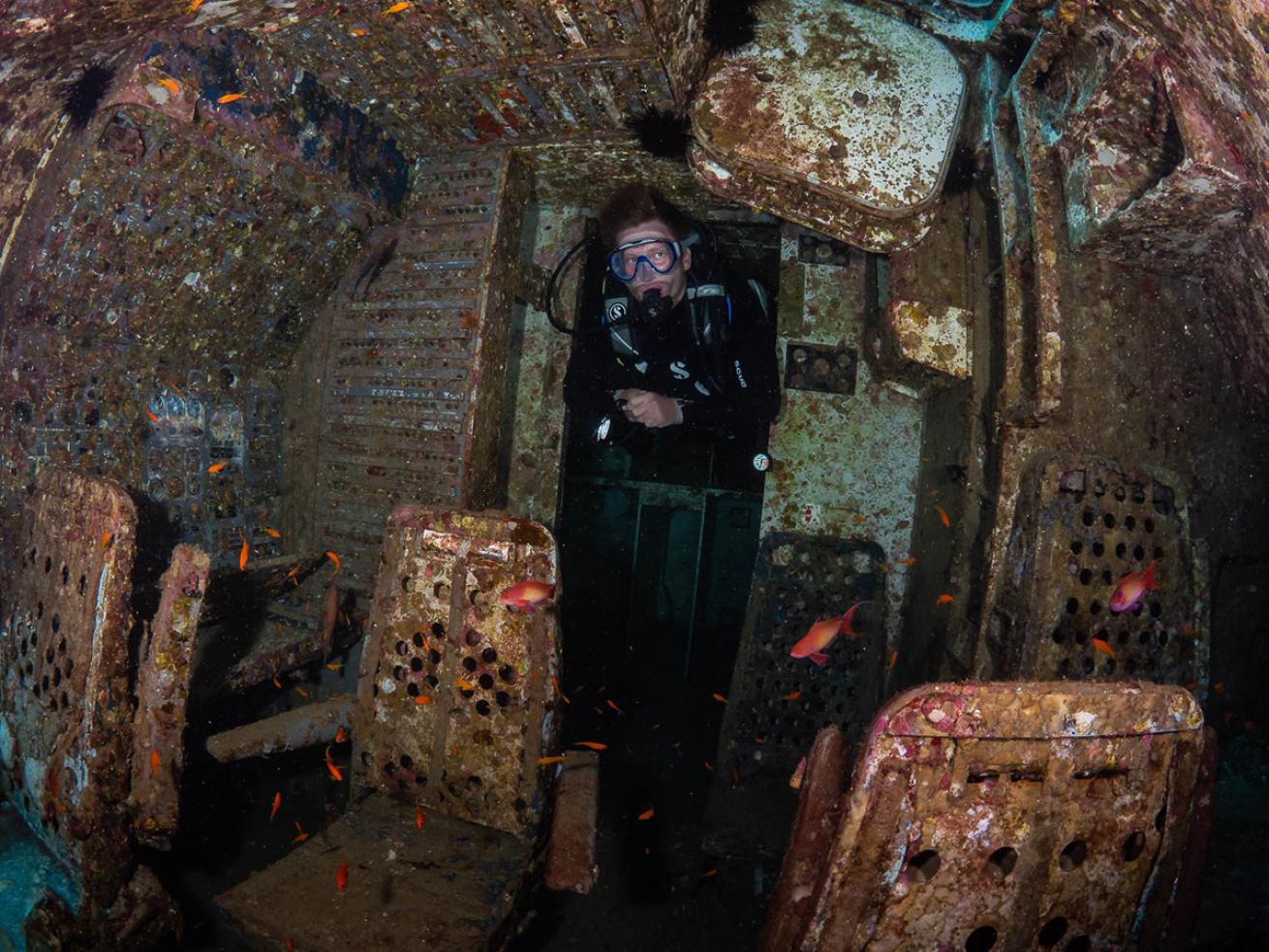 Diver inside Red Sea airplane