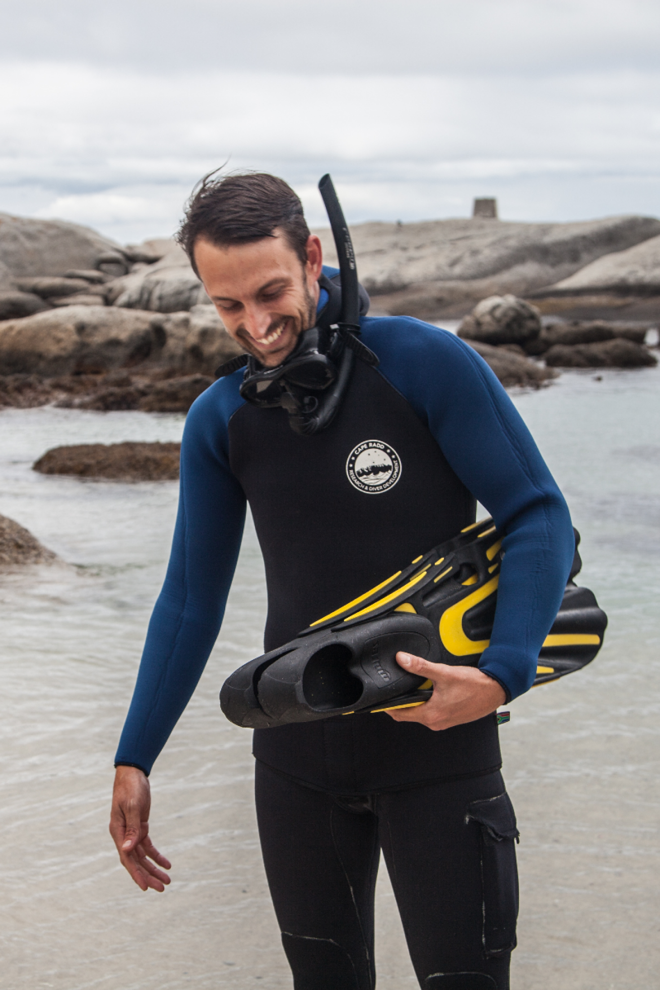 Mike Barron in dive gear on beach