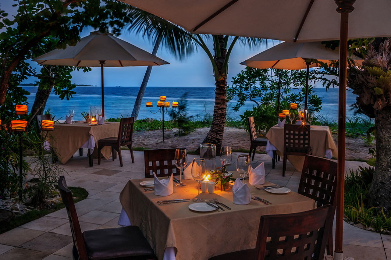 Tables overlooking the ocean in the evening