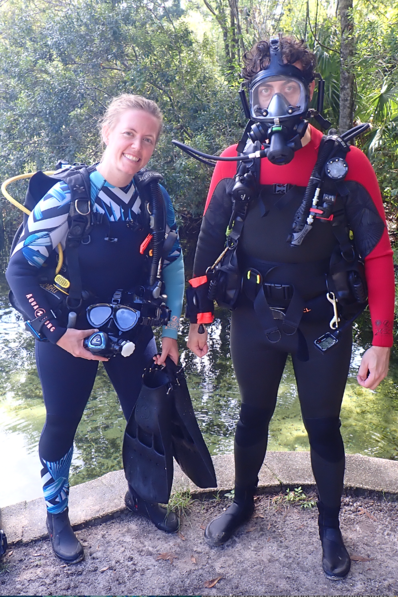 Two divers with a full face mask.