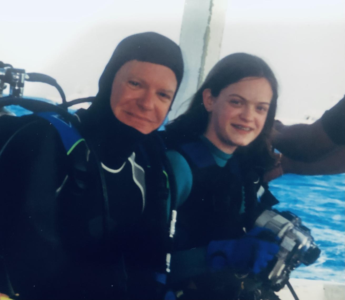 Picture of the author and her father on a boat.