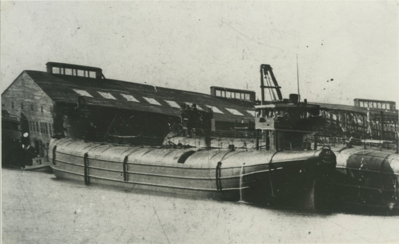 The 300 foot ship Barge 129 at dock.