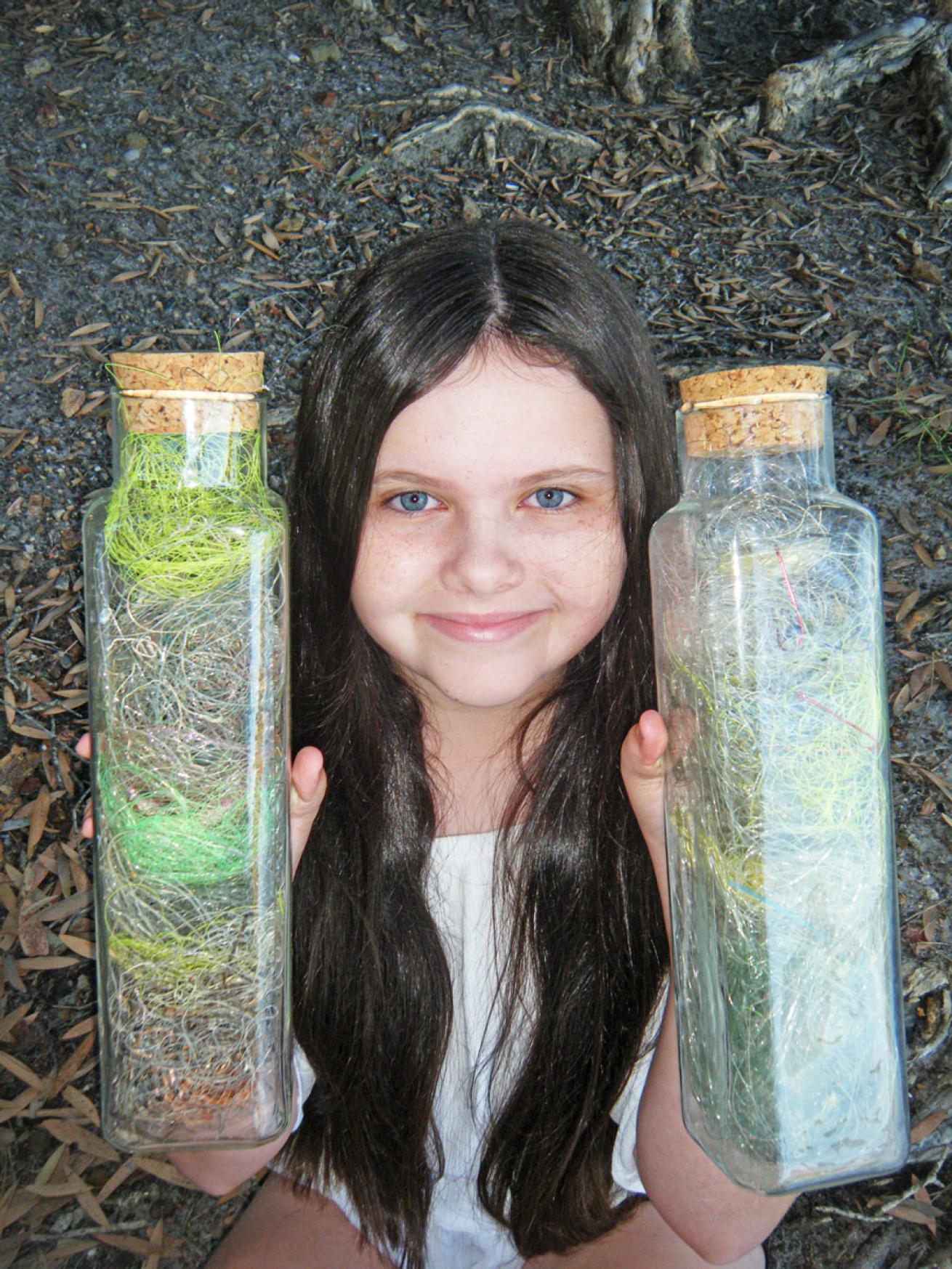 Leesfield holds jars of discarded fishing line