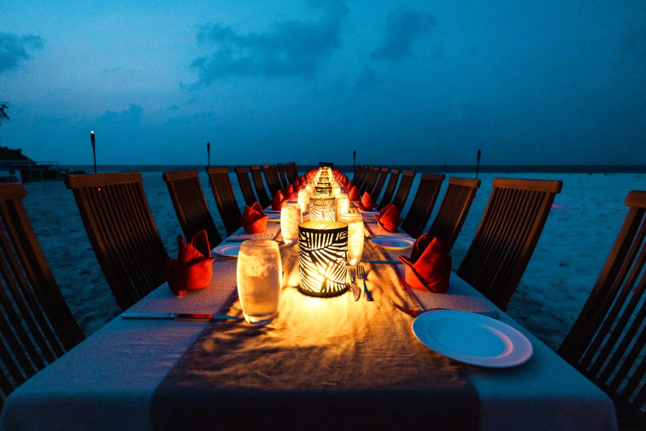 a table set for liveaboard guests to dine under the stars