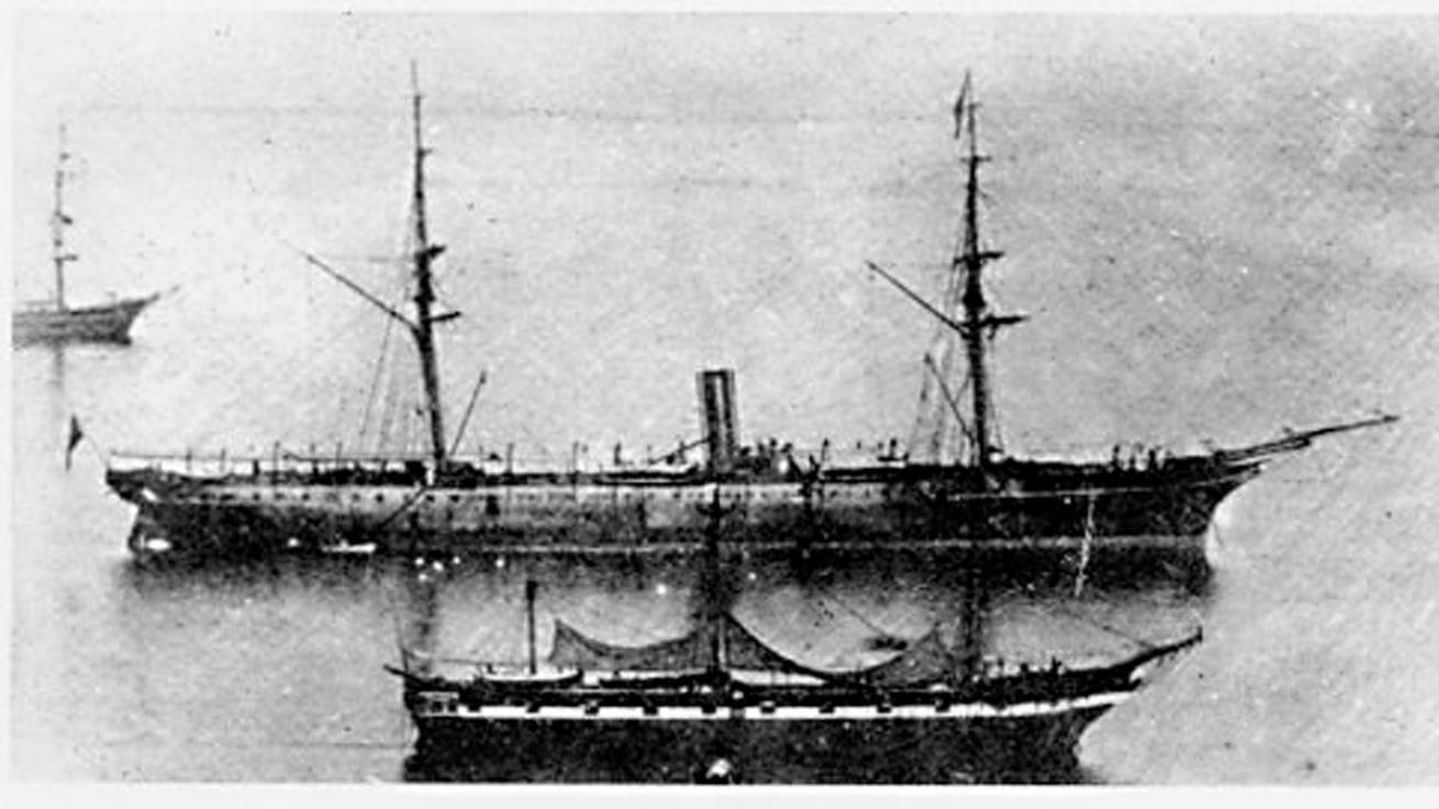 Photograph of steamship RMS Rhone next to Solent in 1865.
