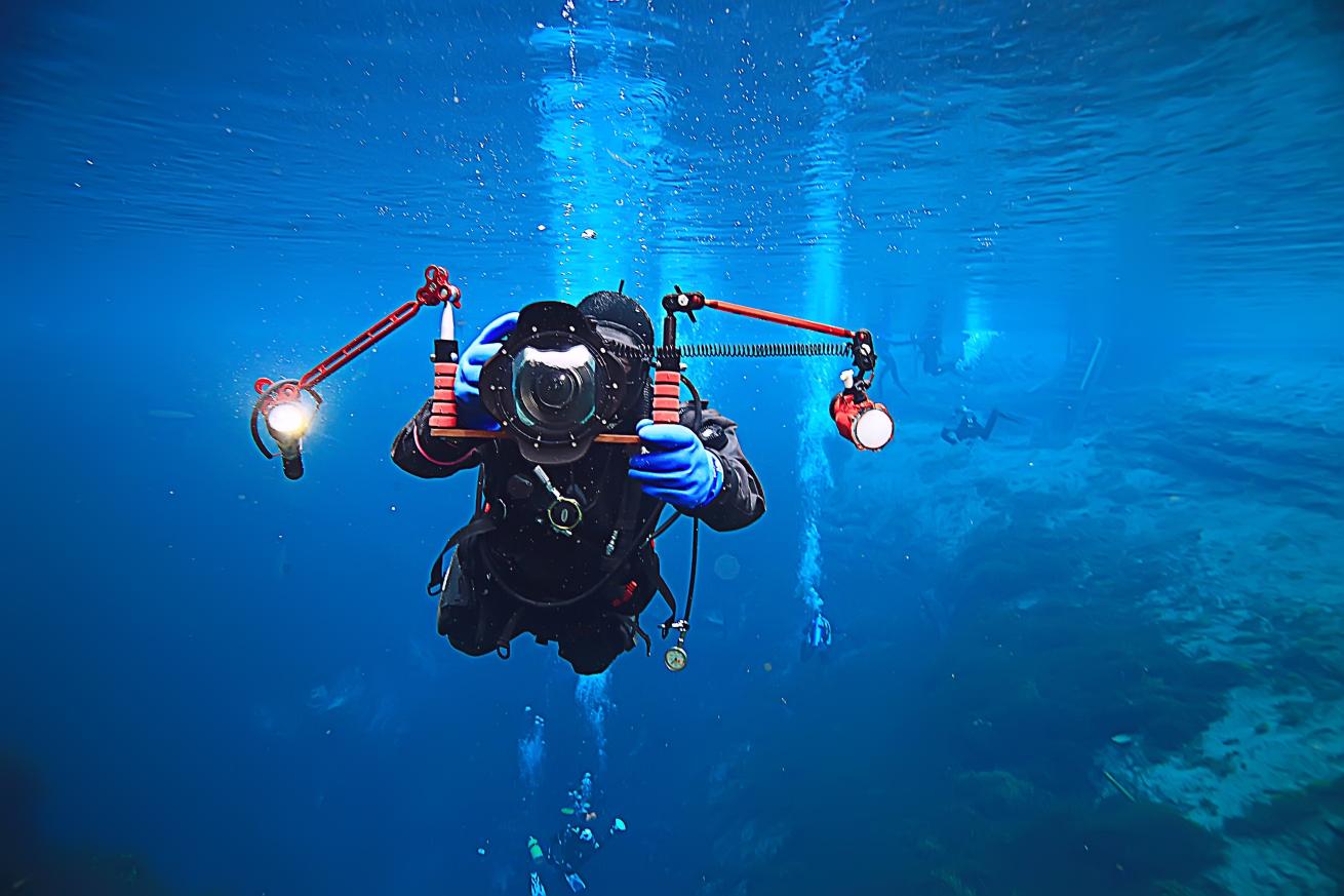 Diver with wide angle lens on camera