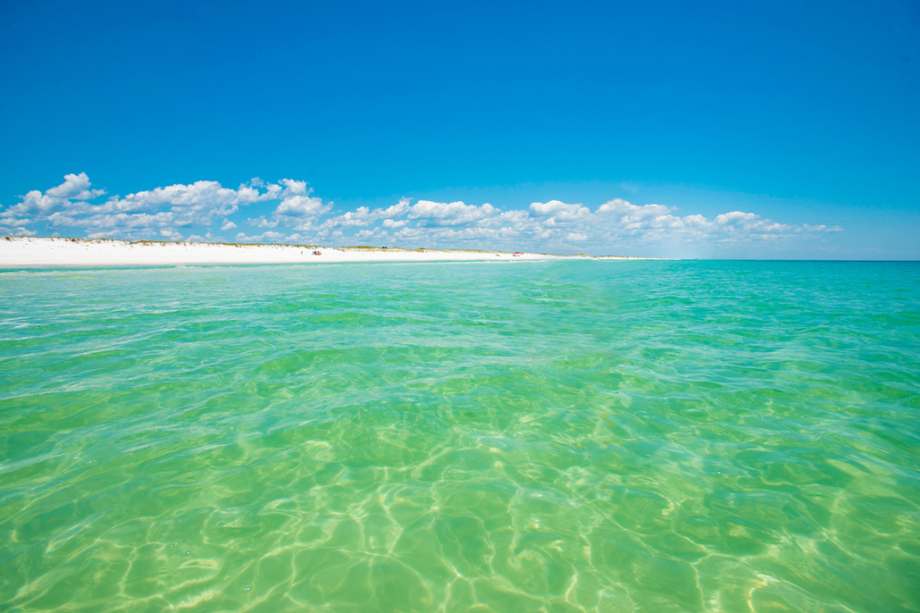 Emerald ocean water and white sand coastline