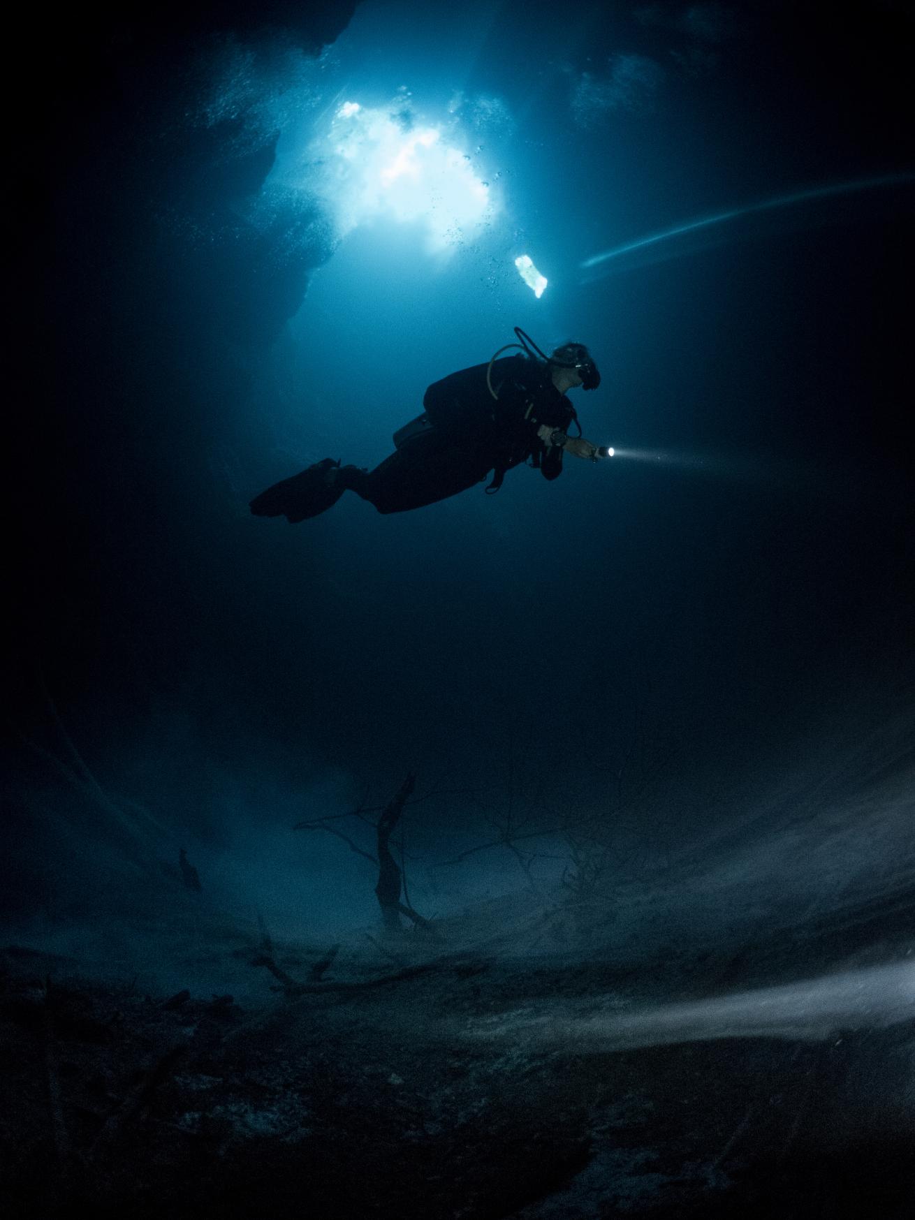 A diver in a cavern.
